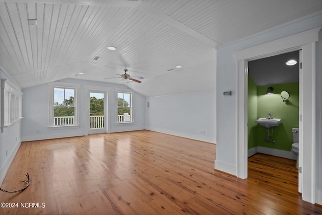 interior space featuring wood ceiling, vaulted ceiling, ceiling fan, and light hardwood / wood-style floors