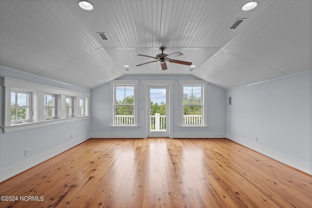 additional living space with ceiling fan, wood ceiling, vaulted ceiling, and light hardwood / wood-style flooring