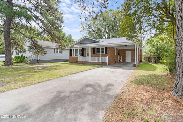 ranch-style house with a front lawn and a carport