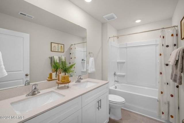 full bathroom with shower / bath combination with curtain, toilet, and vanity