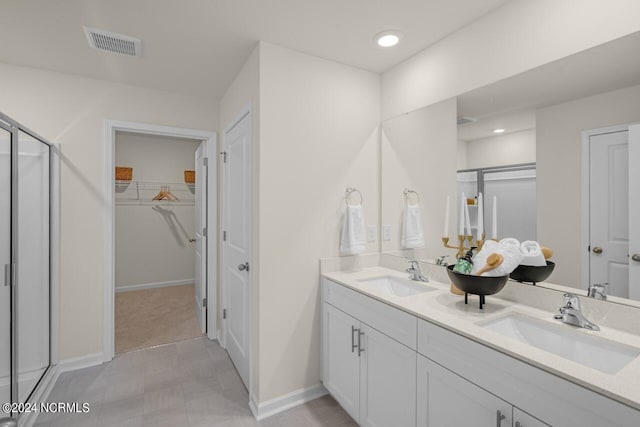 bathroom with an enclosed shower and vanity