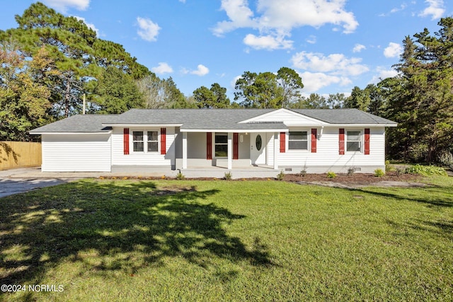 single story home featuring covered porch and a front yard