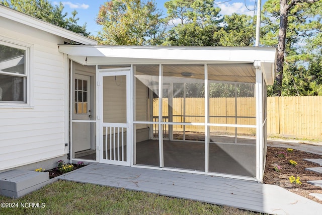 exterior space featuring a sunroom