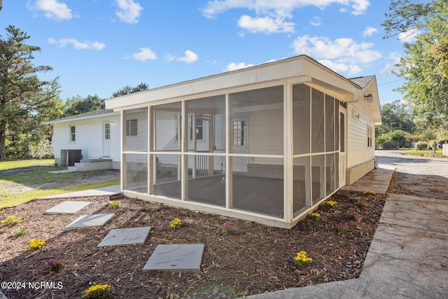 back of house with a sunroom