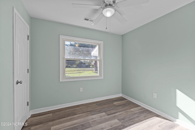 empty room featuring wood-type flooring and ceiling fan