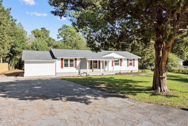 ranch-style home with a front lawn