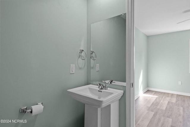 bathroom featuring sink and hardwood / wood-style floors