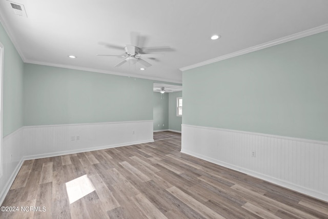 unfurnished room with light hardwood / wood-style flooring, ceiling fan, and ornamental molding