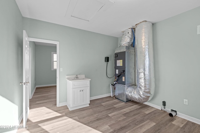 interior space featuring light wood-type flooring and sink