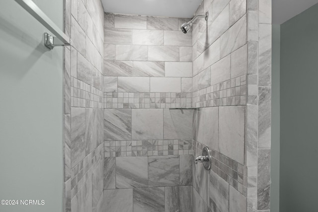 bathroom with tiled shower