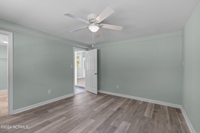 interior space with ceiling fan and light hardwood / wood-style flooring