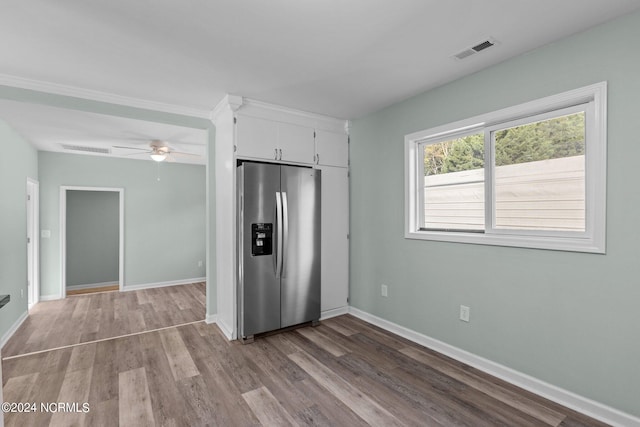 kitchen featuring ceiling fan, white cabinets, stainless steel refrigerator with ice dispenser, and light hardwood / wood-style floors