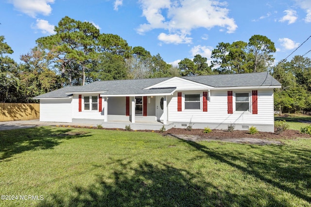 ranch-style house with a front lawn