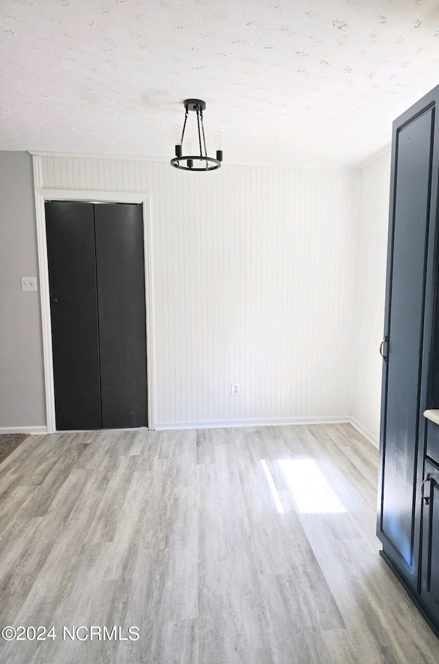 unfurnished dining area with light hardwood / wood-style flooring