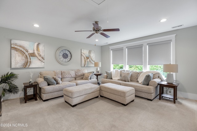 living room with ceiling fan and light carpet