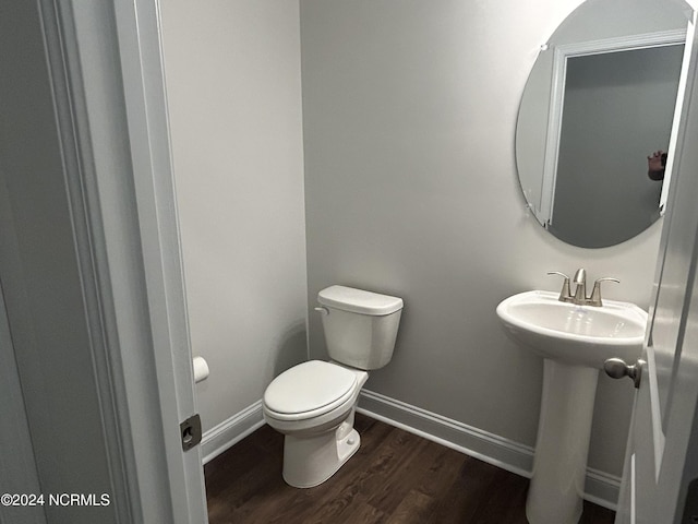 200 Flora Field Dr, Jacksonville, NC 28546 - half bathroom featuring a sink, toilet, wood finished floors, and baseboards