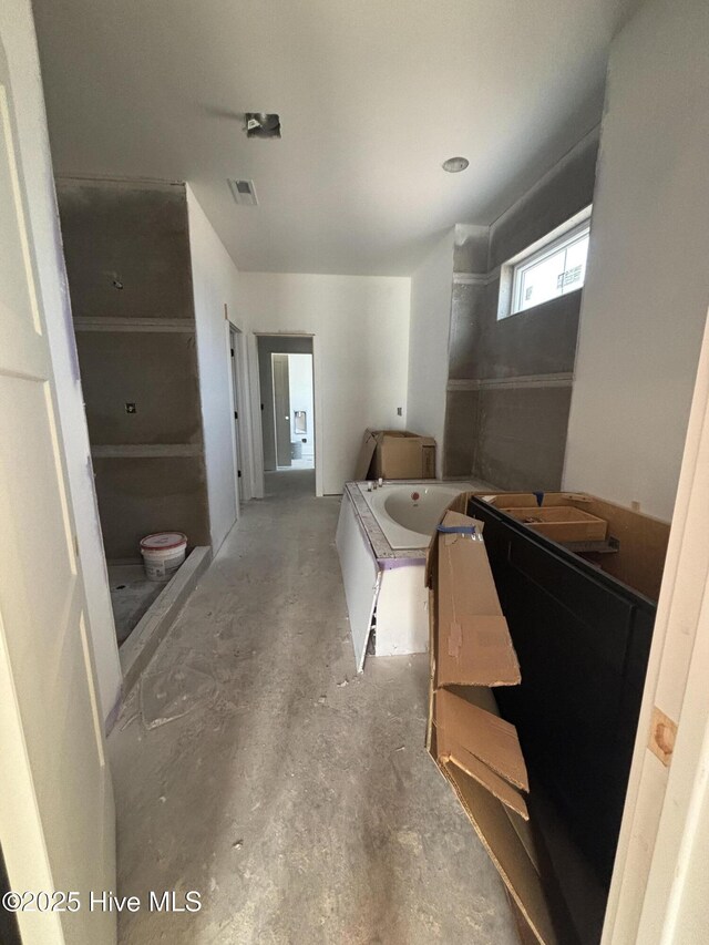 bonus room featuring high vaulted ceiling and french doors