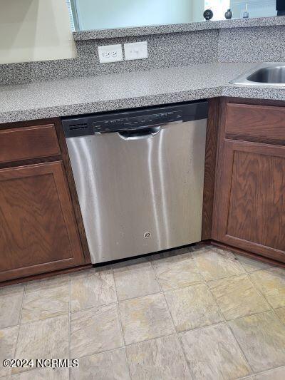 kitchen featuring dishwasher and sink