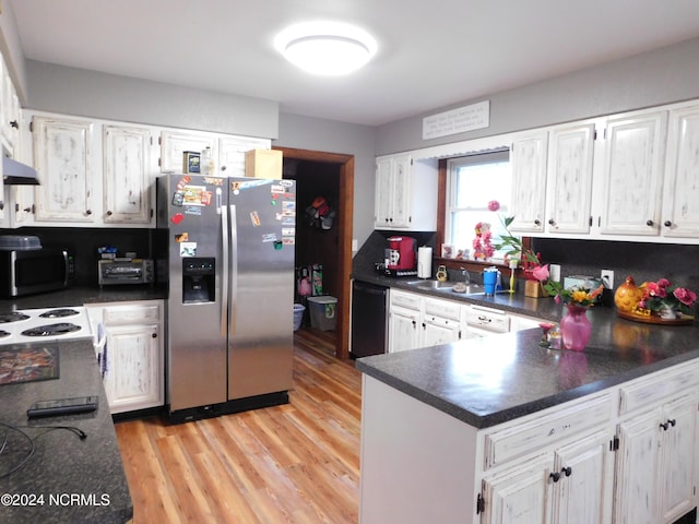 kitchen with white cabinets, stainless steel appliances, light wood-type flooring, and sink