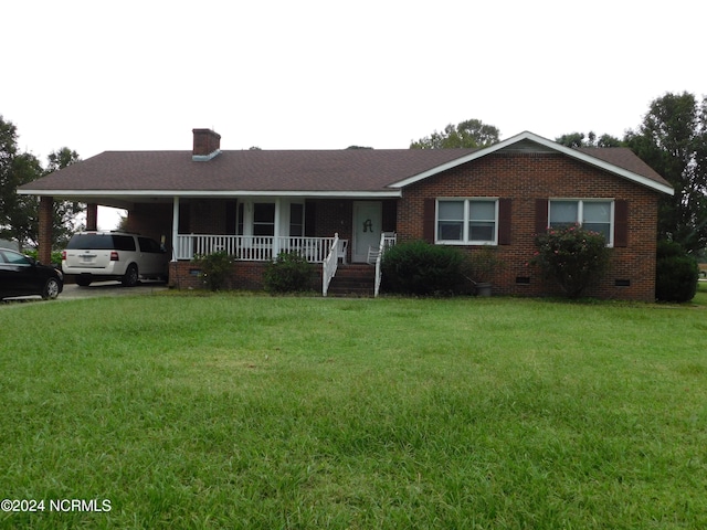 ranch-style home with a carport, a front yard, and covered porch