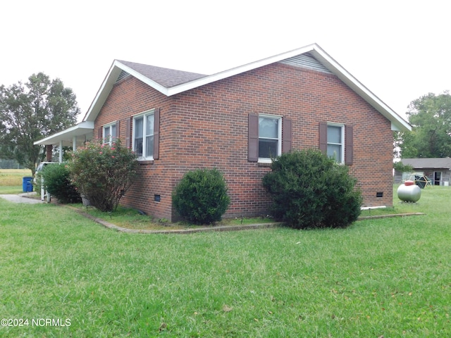 view of home's exterior with a lawn