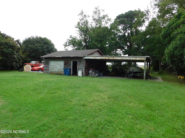 exterior space featuring a yard and a carport