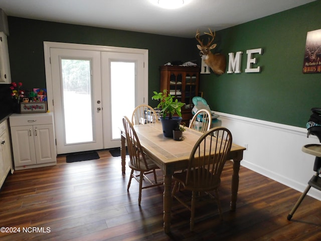 dining area with french doors and dark wood-type flooring