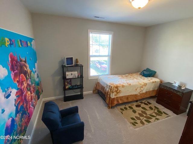 bedroom with light carpet