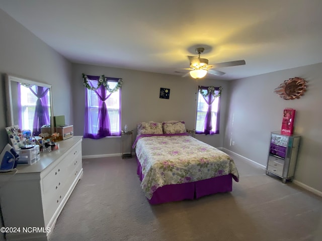 carpeted bedroom featuring ceiling fan