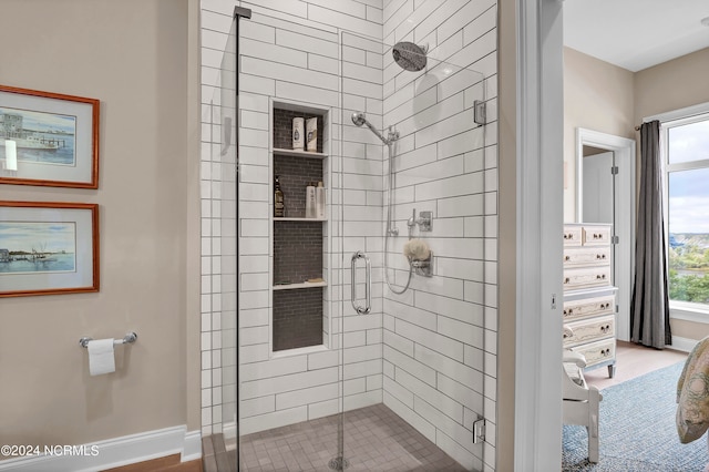 bathroom with a shower with shower door