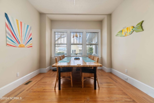 dining room with hardwood / wood-style floors