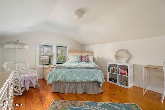 bedroom featuring wood-type flooring and lofted ceiling