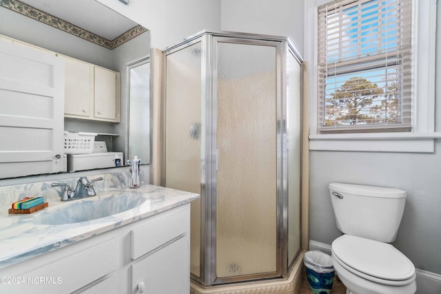 bathroom with walk in shower, vanity, and toilet