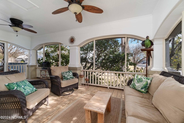 sunroom / solarium with ceiling fan