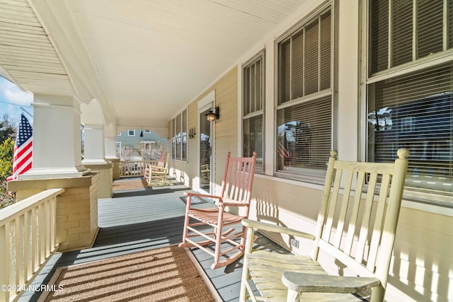 wooden deck featuring covered porch