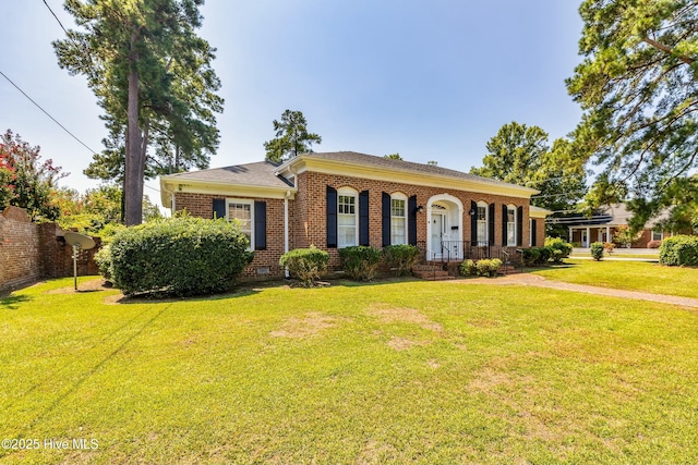 rear view of house featuring a lawn and cooling unit