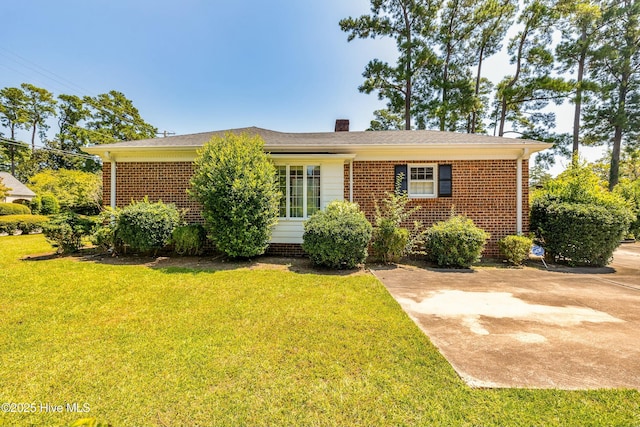 view of front of house featuring a patio area and a front yard