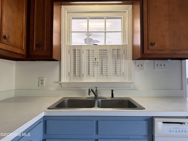 kitchen with sink and white dishwasher