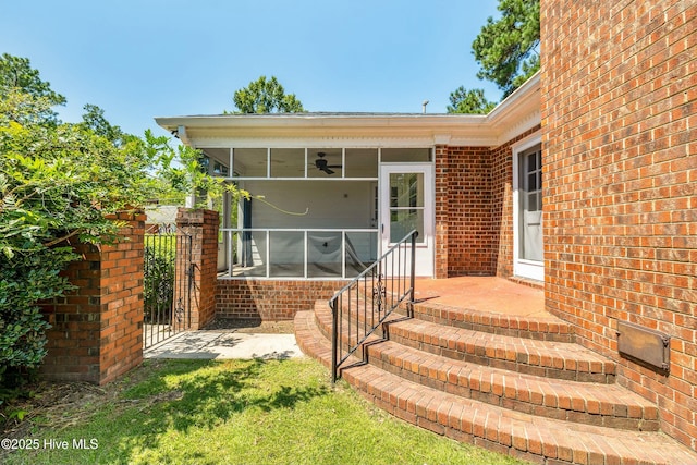 view of patio / terrace featuring a sunroom