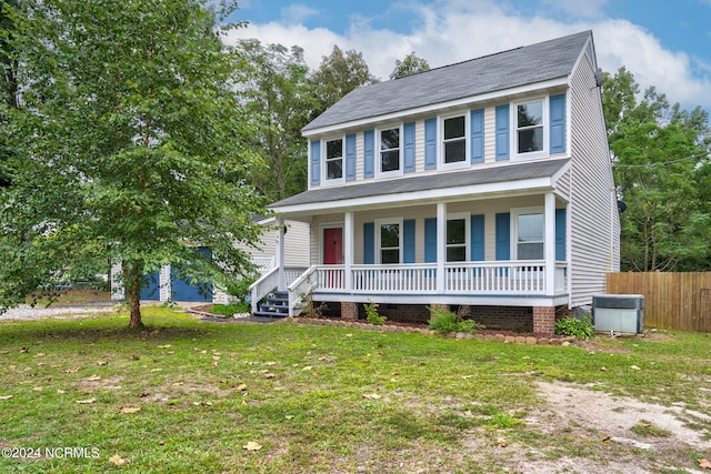 view of front facade featuring a front yard and covered porch