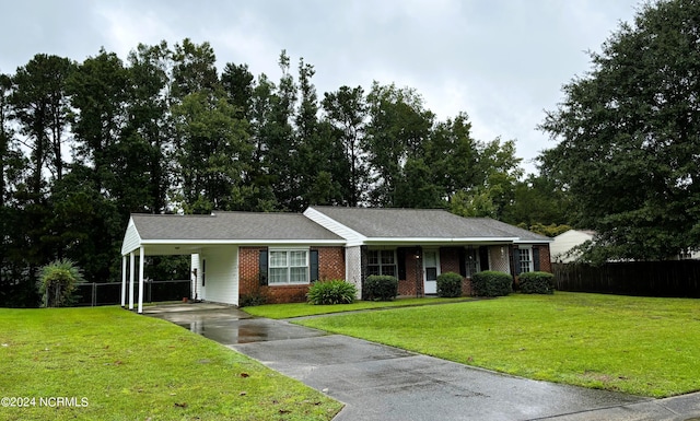 single story home featuring a front yard and a carport