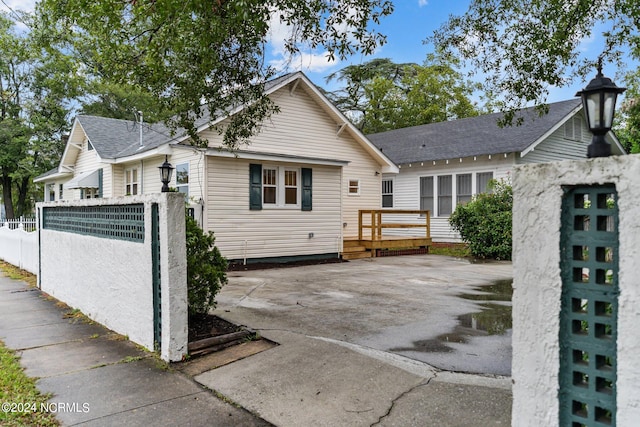 view of front of property with a patio area and a deck