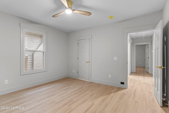 unfurnished room with ceiling fan and light hardwood / wood-style floors