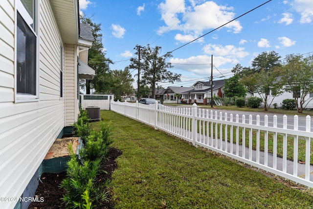 view of yard featuring central AC