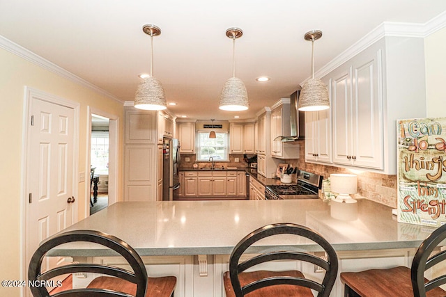 kitchen featuring a kitchen breakfast bar, wall chimney exhaust hood, stainless steel appliances, and kitchen peninsula