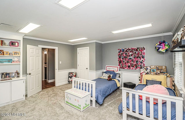 bedroom featuring crown molding and carpet