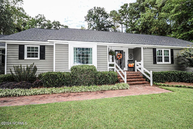 ranch-style home with a front yard