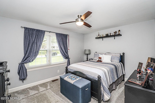 bedroom with ceiling fan and carpet flooring