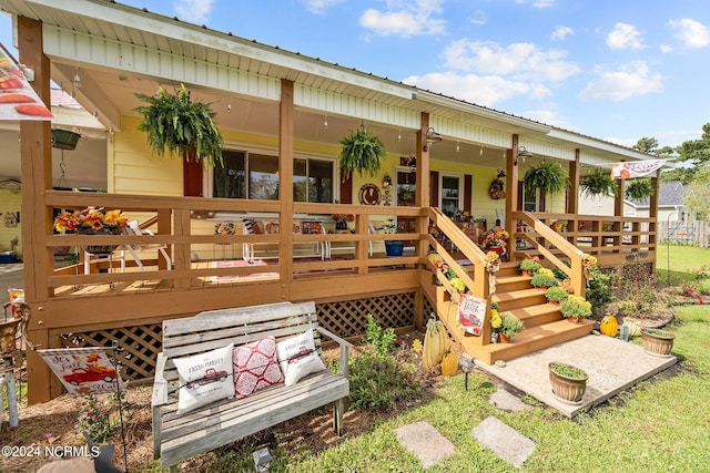 exterior space with a deck and a yard