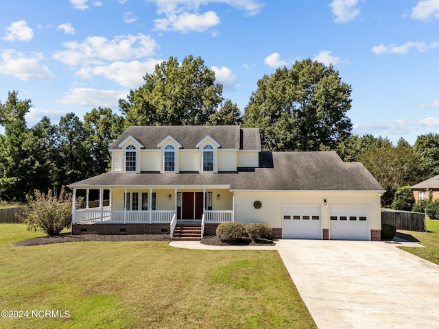 country-style home with a garage, a front lawn, and covered porch